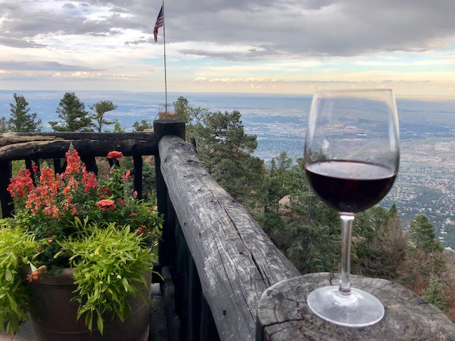 On the wraparound porch 3,000 feet above the town of Colorado Springs. Photo by Claudia Carbone