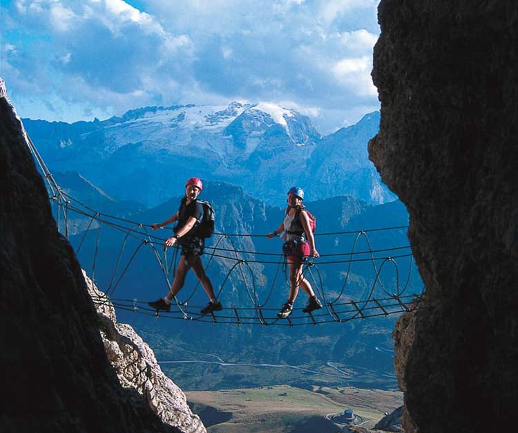 Via ferrata route in the Dolomoties with suspended bridge. Photo by Herbert Summerer