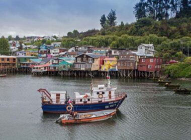 ”Palafitos”, wooden stilt houses, some centuries old, line the west shore of Fiordo de Castro bay, Chiloé, Chile. ©Steve Haggerty/ColorWorld