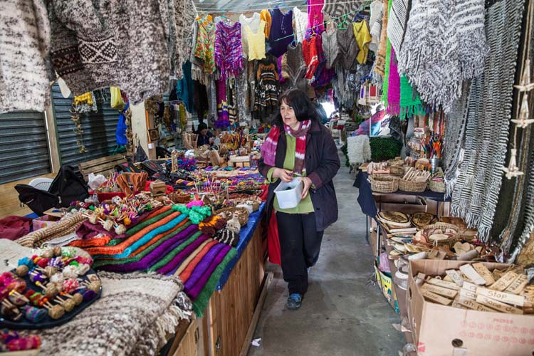 Feria Artesanal (artist’s market) in Dalcahue is the place to buy hand-knit woolen shawls and wood carvings, Chiloé, Chile. ©Steve Haggerty/ColorWorld