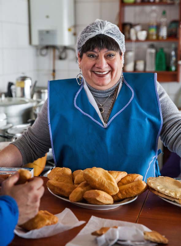 Cheerful smiles and just-baked pastries welcome visitors to the Castro market, Chiloé, Chile. ©Steve Haggerty/ColorWorld