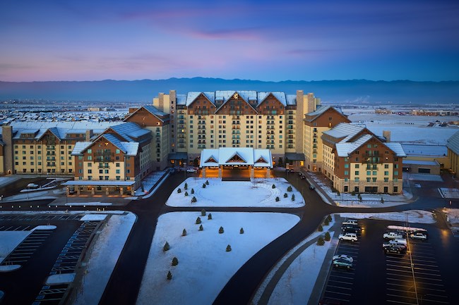Gaylord Rockies Resort & Convention Center with the Colorado Rockies in the distance. Photo courtesy of Gaylord Rockies