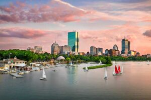 While traveling in Boston, we see sail boats catch the breeze on the Charles River against the Back Bay skyline. Photo by Kyle Klein