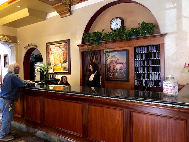 Old school front desk. Photo by Claudia Carbone