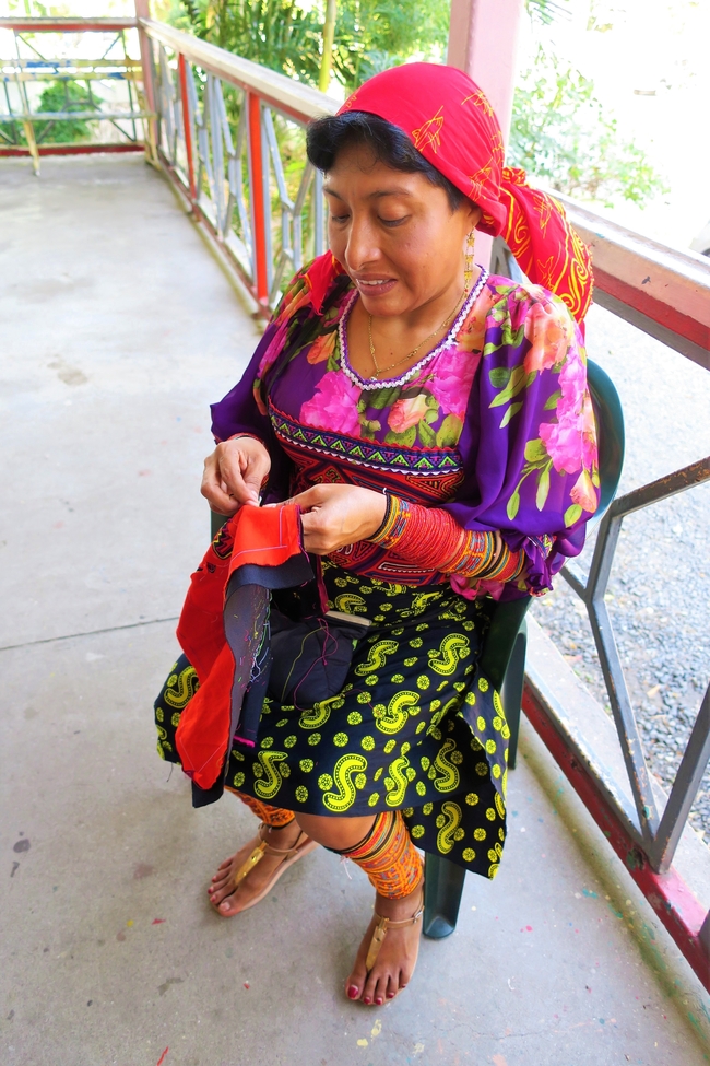 A Kuna woman embroidering a Mola. Photo by Victor Block