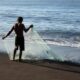 Fisherman on the black sands of Monterrico