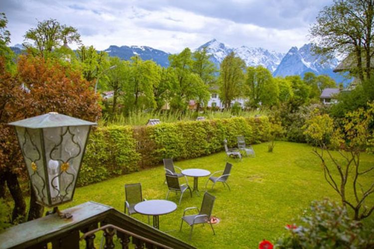 View of garden and snow covered mountains