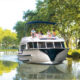 Rent boat to see canals in France and Netherlands
