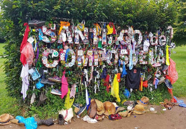 A welcoming sign made out of travelers clothing