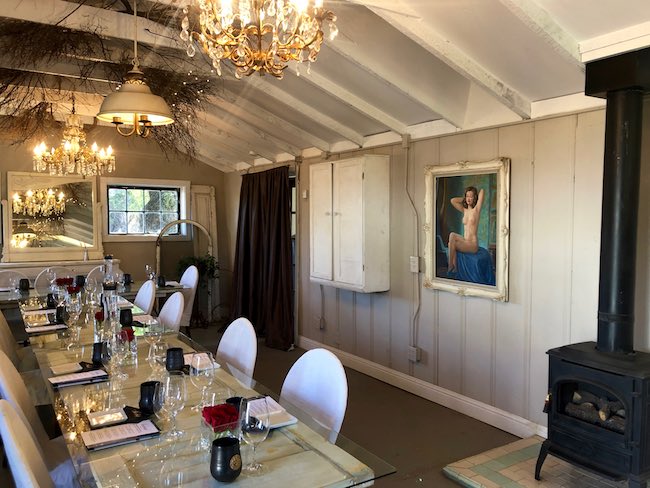 Tasting event room with Edna's photo on the wall. Photo by Claudia Carbone