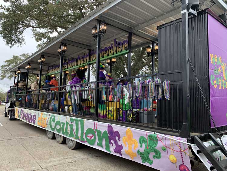 Parade float loaded down with beads to throw. Photo by Janna Graber