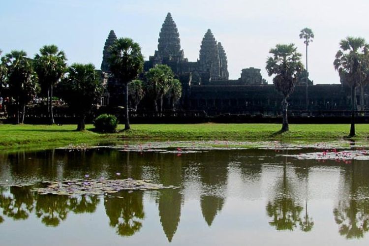 reflection of the five carved lotus-flower towers of Angkor Wat Temple