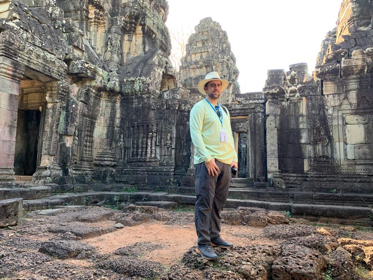 Standing at the temple ruins.