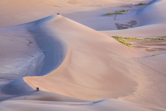 Hikers making their way through Great Sand Dunes National Park. Photo by Marek Uliasz/Dreamstime.com