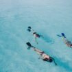 Snorkeling toward a ship.