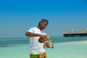 World Snapshots: The Maldivian Toddy Tapper of Coco Palm Dhuni Kolhu