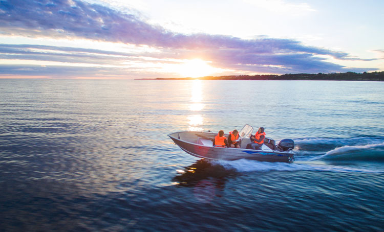 People enjoying a sunset boat ride to see the islands.