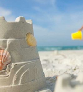 Kids play in the sand making castles on Miami Beach.