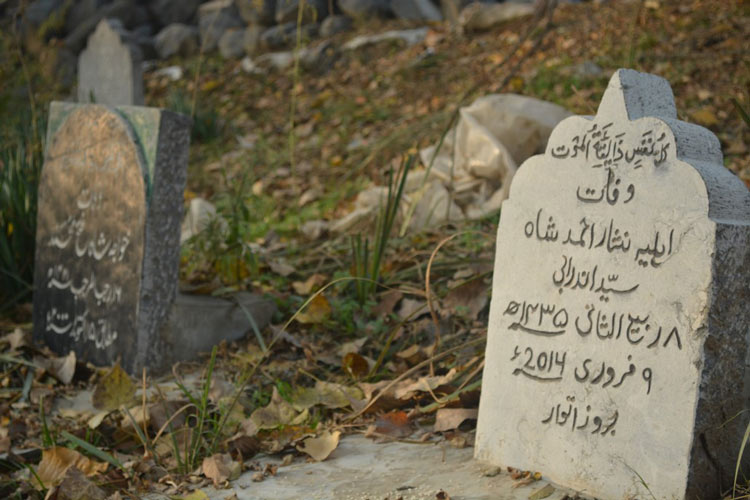 Hand carved epitaphs on tombstones in Kashmir.