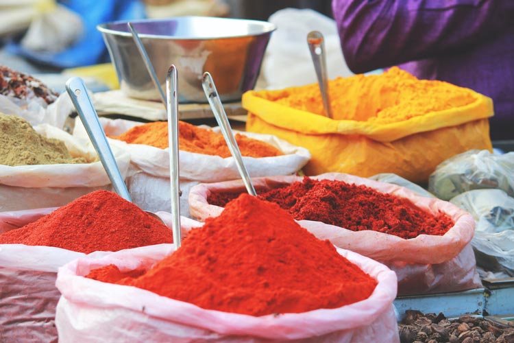 Assortment of color powders used for celebrations in a market in Mapusa, India.