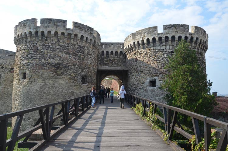 Tourists gather to take photos at one of the arches entering Belgrade Fortress.