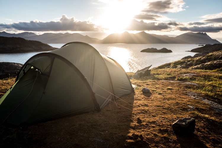 A campground in Croatia overlooking the ocean waters and cliffs.