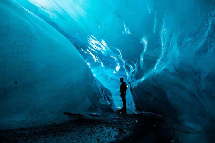 A man going to explore deep into a glacier at Vatnajökull National Park, Iceland.
