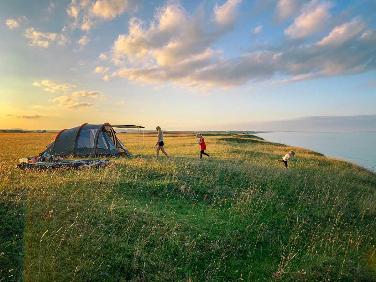 A family camping on the coast