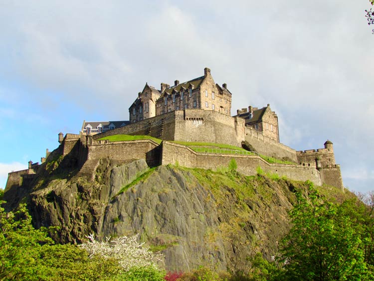 Edinburgh Castle on Castle Rock towering over Edinburgh, Scotland.