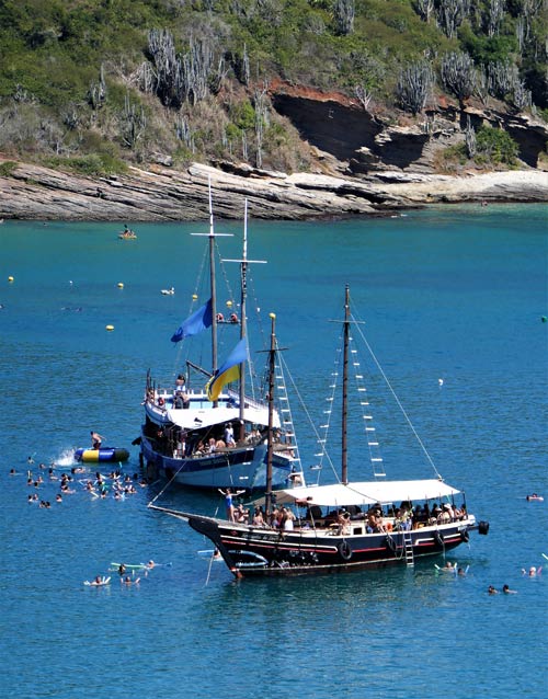 Schooners in the bright blue Buzios water.