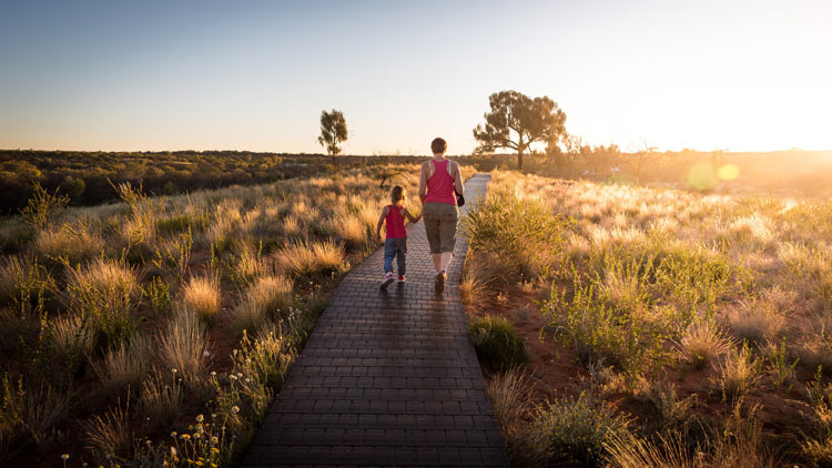 Mom and daughter enjoying the state park walk through nature.