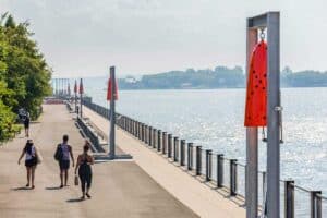 Along the waterfront at Brooklyn Bridge Park, Reverberation is a new large-scale installation by Davina Semo made up of interactive bells.
