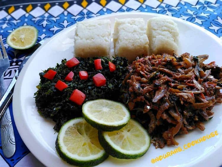 Another plate found in Kenya full of Ugali, Omena and vegetables.