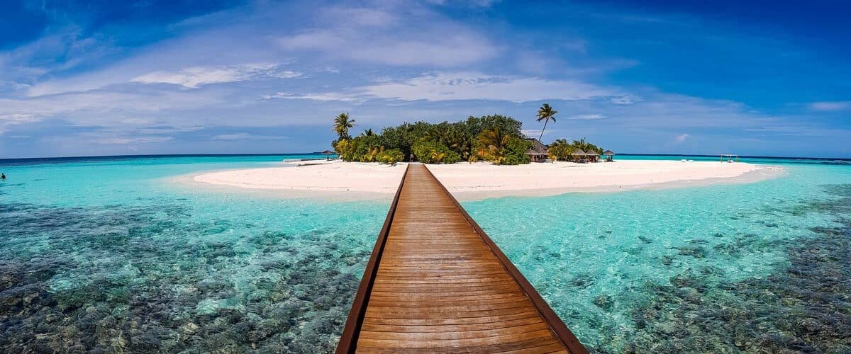 Walk over ocean to a beach in Maldives.
