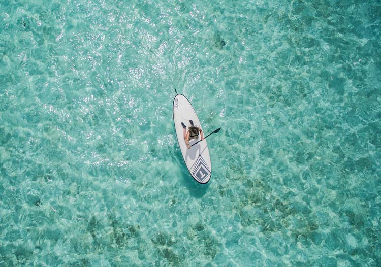 Paddle-boarding is one of the many activities the resorts offers in the Maldvives.