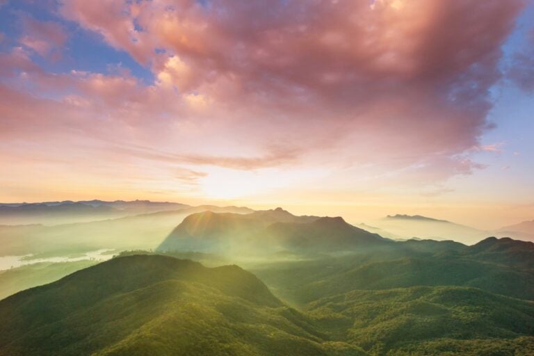 Stunning sunrise view from Adam's Peak, Sri Lanka's holy mountain. Photo by Kamchatka via Canva