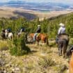 Horseback riding during a family dude ranch vacation.