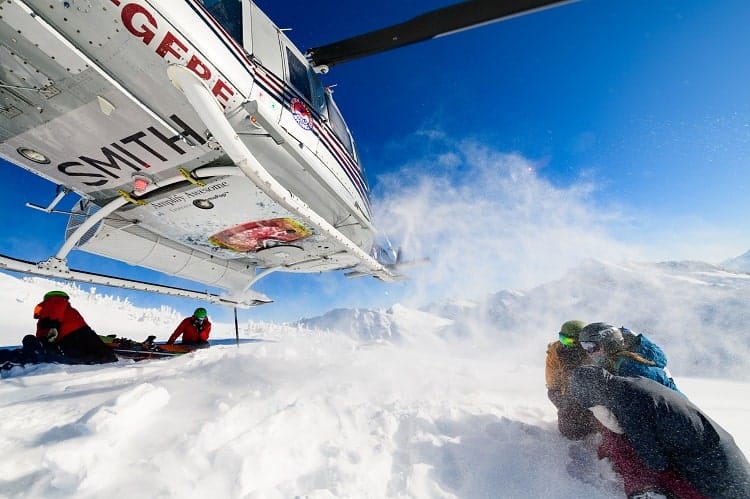 Heli-skiing arrival at top of the mountain