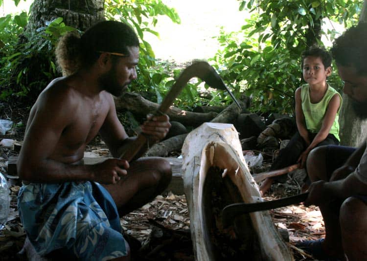 Carving the canoe in Yap. 