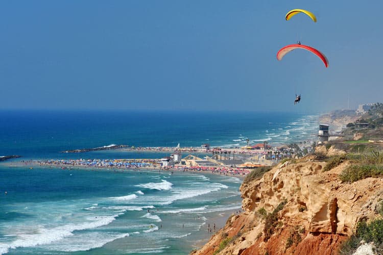 Paragliders on coast of Netanya.