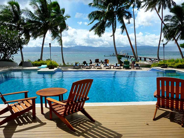 Pool and boat dock at the Jean-Michel Cousteau Resort.