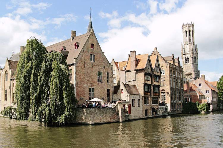 Couples can delight visiting the Belfry Tower in Bruges, Belgium during their romantic getaway