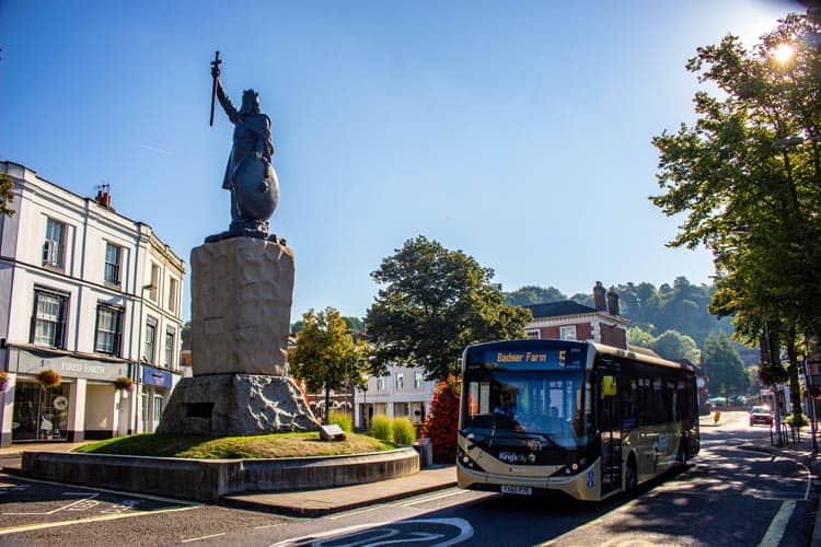 Bustling city center passing the monuments and statues of Winchester