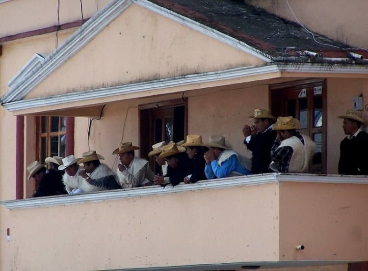 Village elders lined on a balcony in Chiapas