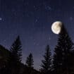 Starry sky and full moon over the Alps, Italy