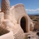 Earthship homes are completely sustainable, residents living off rainwater, homegrown food and sunshine. CC Image by theregeneration