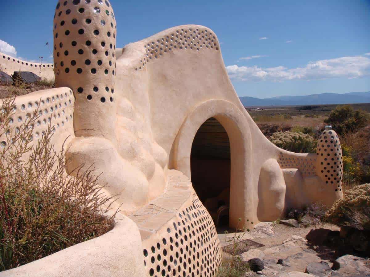 Earthship homes are completely sustainable, residents living off rainwater, homegrown food and sunshine. CC Image by theregeneration