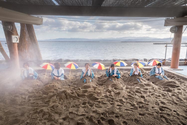 Try a sand bath in Ibusuki, Kagoshima. Photo by KPVB