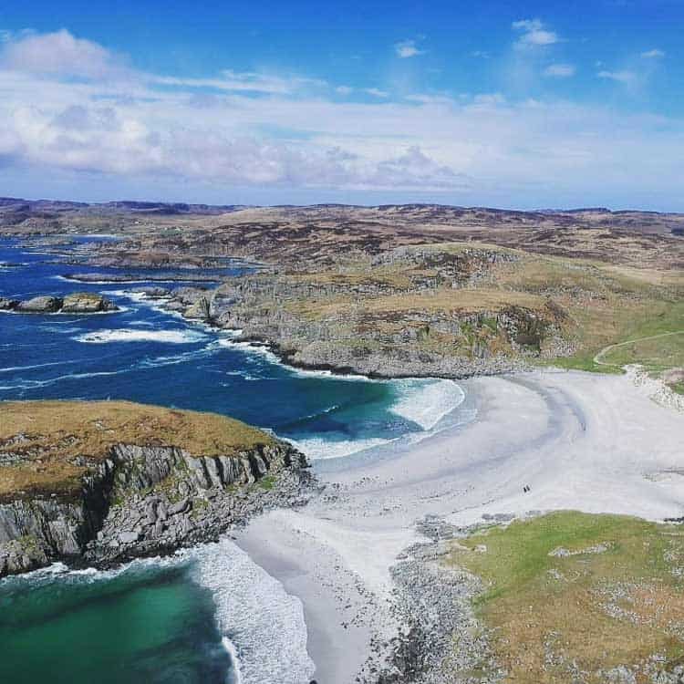 The clear water and hills seen from above at Mull Beach in Scotland. Photo by David