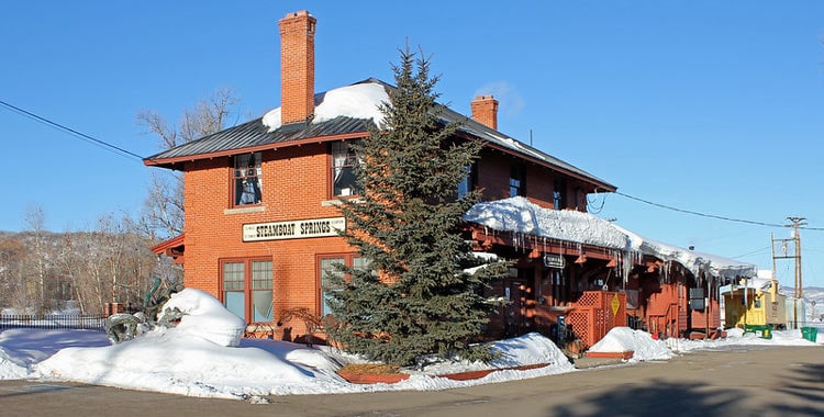 The railroad was constructed in 1903, the historic Steamboat Springs Depot was open to passengers in 1909 but closed in 1968, now the beautiful building remains a reminder of the past and history of Steamboat. CC Image by Jeffery Beall